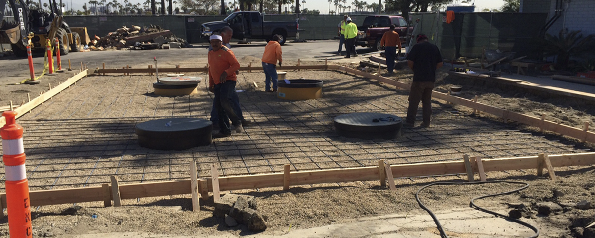 Environmental construction crew with heavy equipment performing cleanup.
