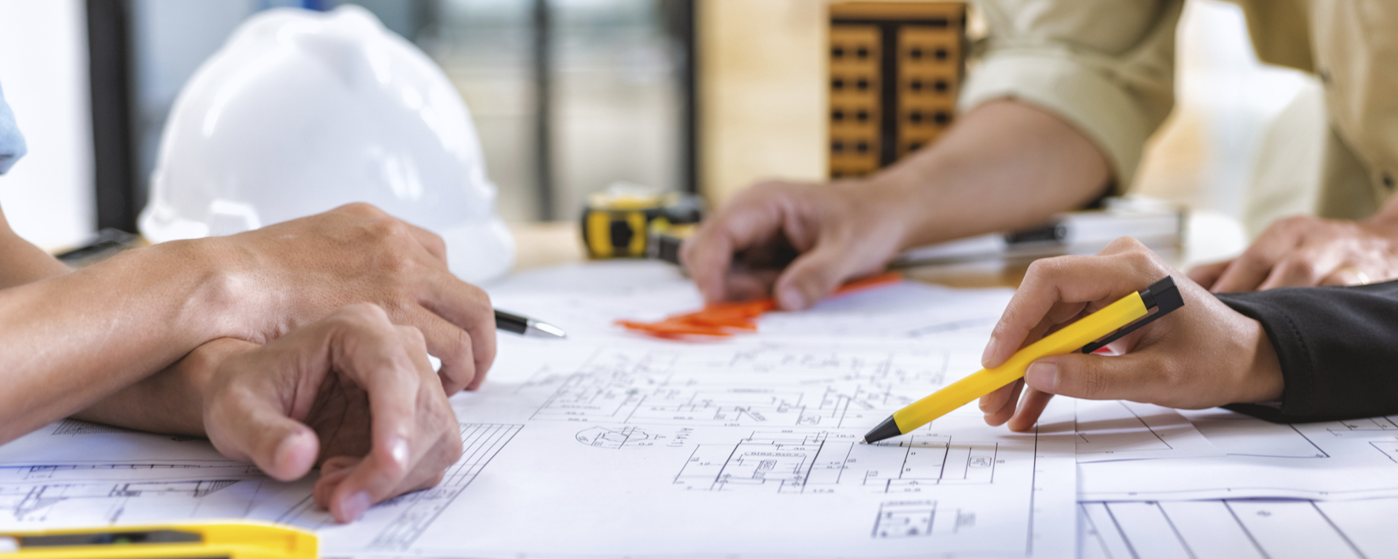 Environmental engineer reviewing remediation system plans.