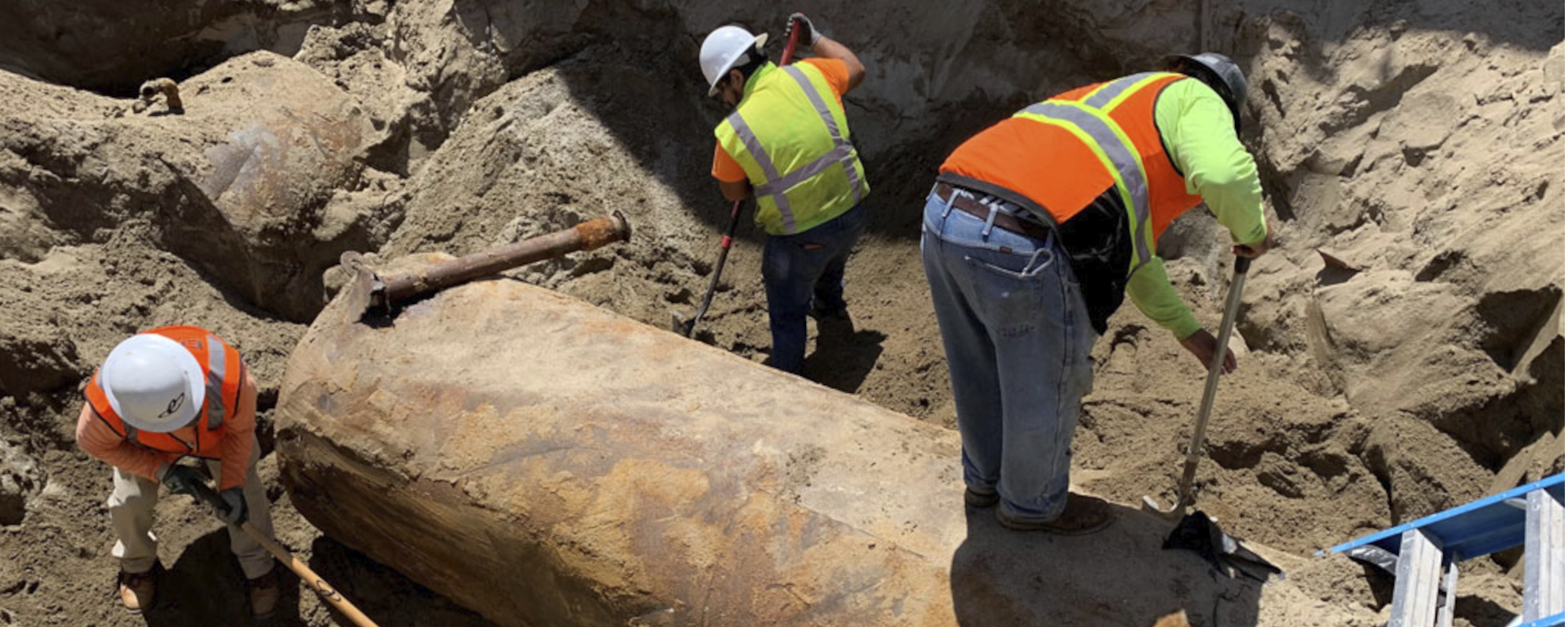 Excavator performing remedial excavation as part of site clean-up.