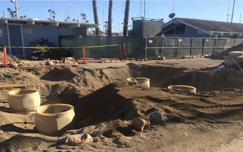Environmental construction crew working with heavy equipment.