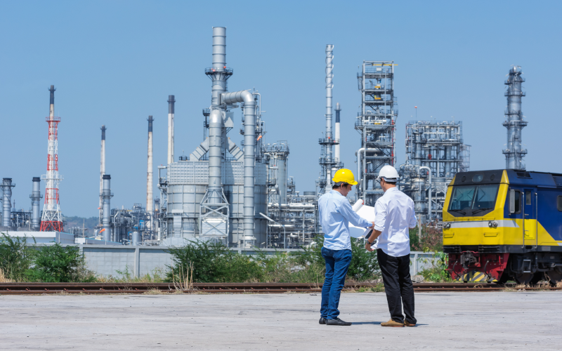 Environmental consultant reviewing plans and regulatory documents.