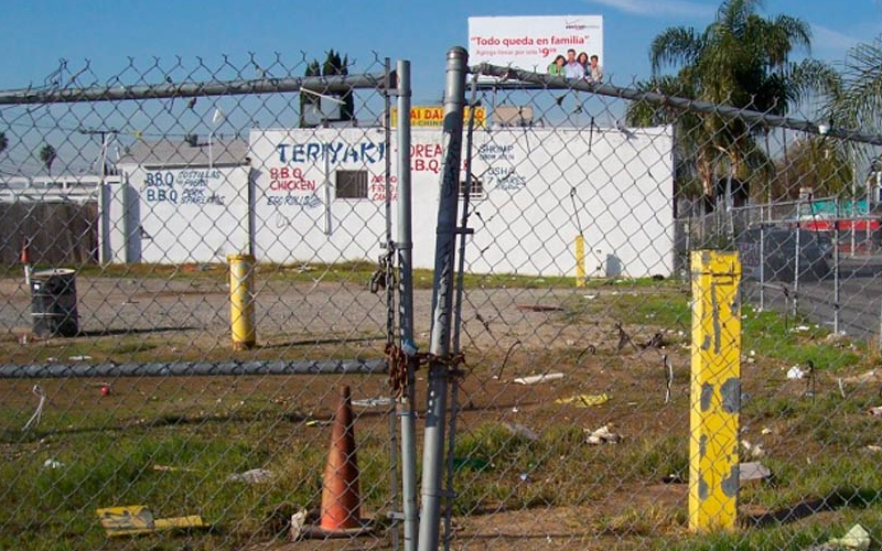 Environmental professional reviewing a property map for a transaction.